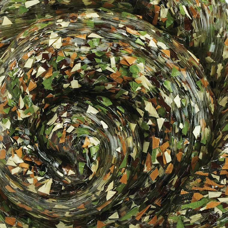 Close up texture of clear putty with camo glitter.