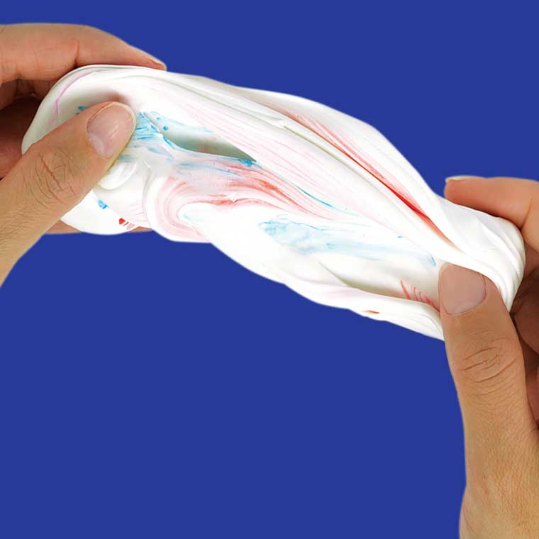 Two hands stretching white putty.