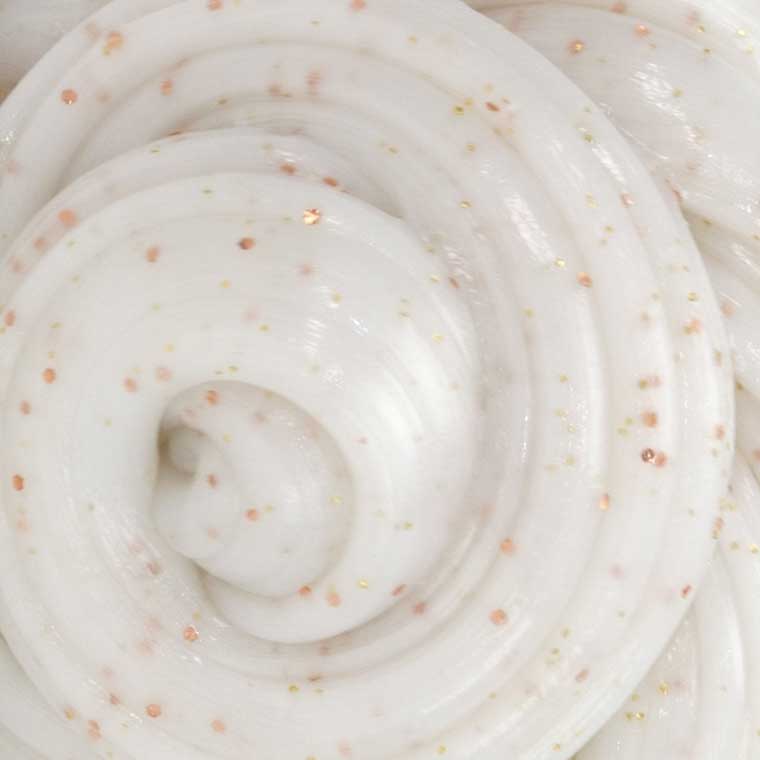 Close up of white speckled putty.